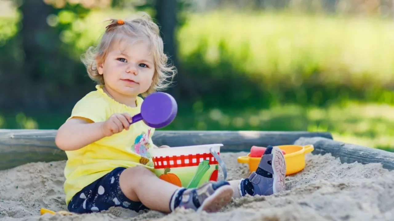 How to Create a Kid-friendly Backyard Without Grass 5 A girl is having fun in a