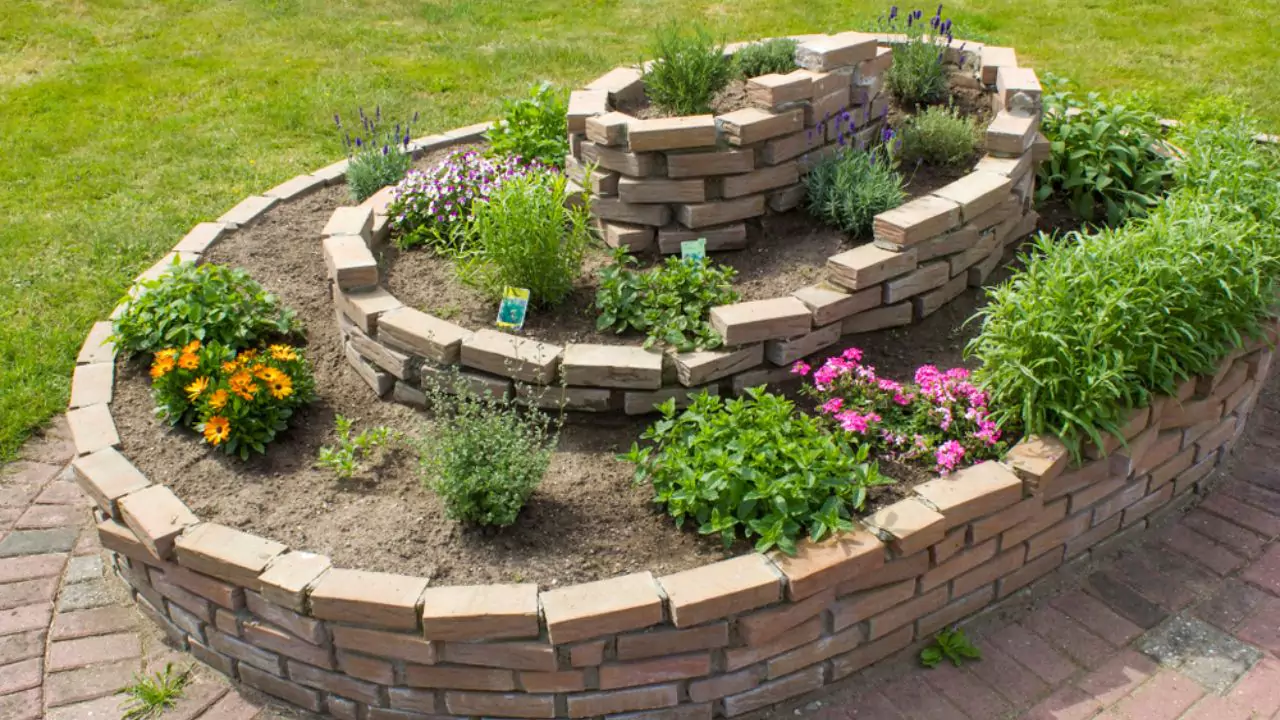18 Cute Garden Rock Ideas: Achieving a Natural and Relaxing Landscape 10 Spiral herb garden design 1